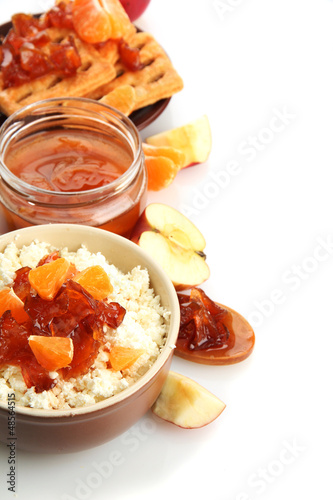 cottage cheese in bowl with homemade fruit jam, isolated