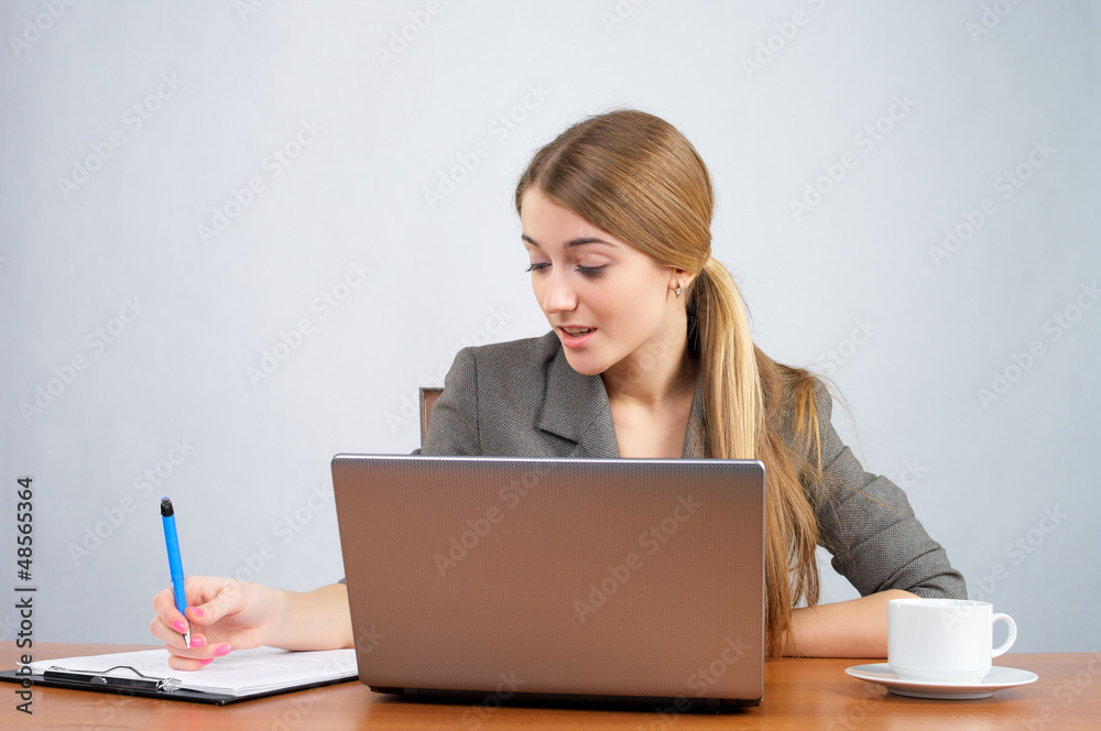 Portrait of a pretty young businesswoman making note Portrait of a pretty young businesswoman making note