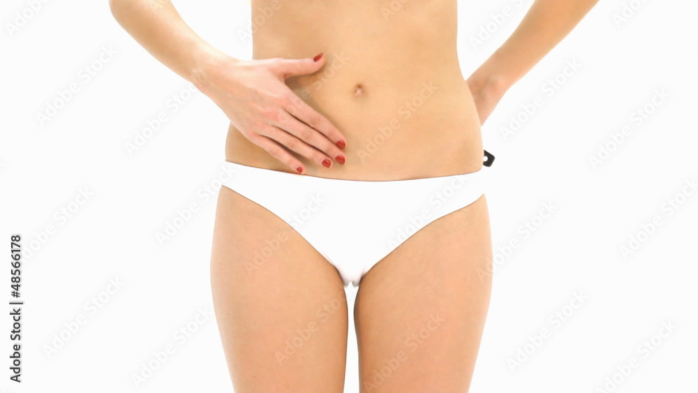 woman analyzing cellulite on her belly
