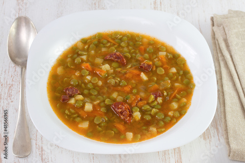 soup with peas and sausages on the plate