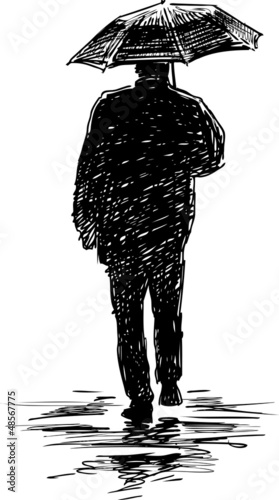 silhouette of a man under an umbrella