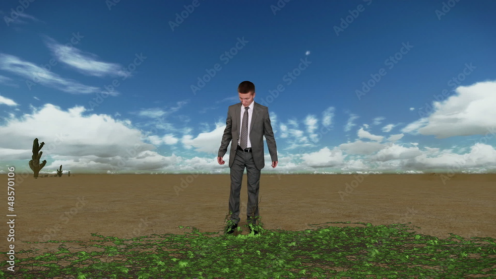 Businessman in Desert with Ivy Growing and Time Lapse Clouds Businessman in Desert with Ivy Growing and Time Lapse Clouds