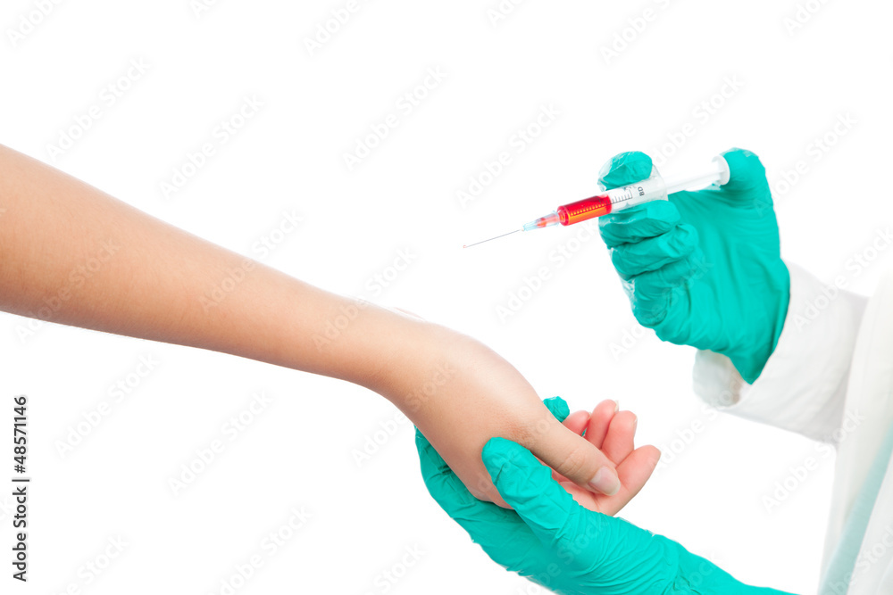 Doctor giving an injection to patient. Isolated on white backgro Doctor giving an injection to patient. Isolated on white backgro