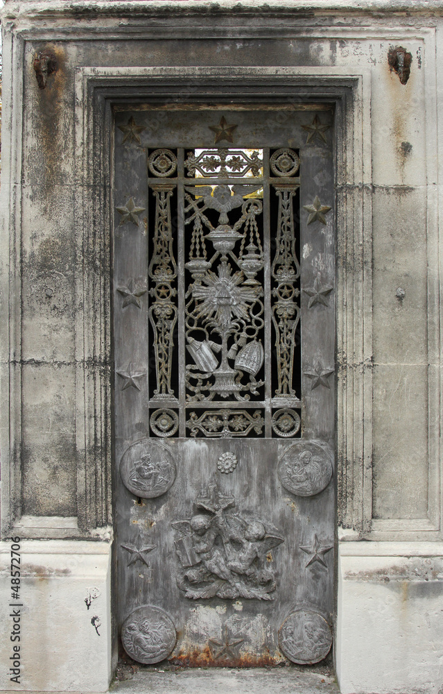 Ornate tomb door in the Pere Lachaise cemetery, Paris