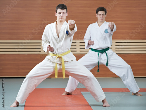 Two man at taekwondo exercises