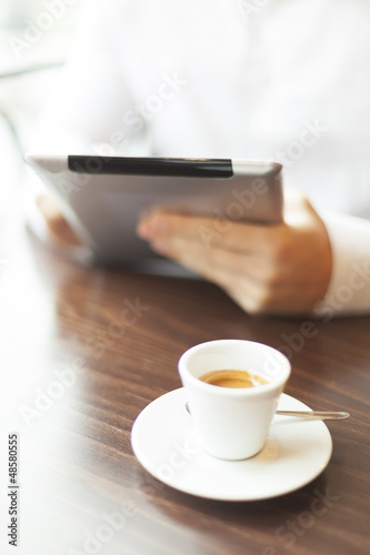 Man reading news at motning on tablet computer