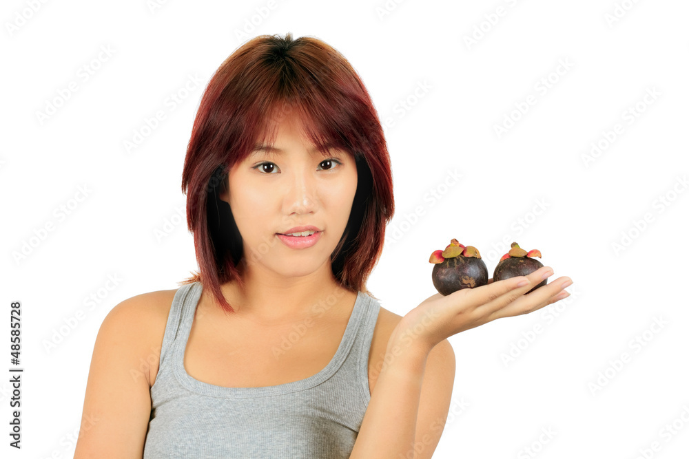 Isolated young asian woman with a mangoesteen over white.