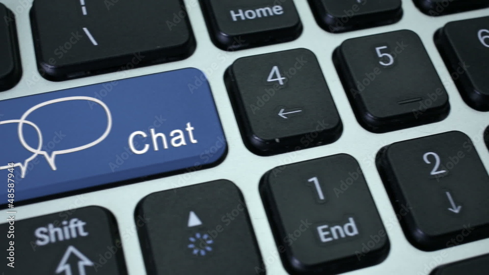 Chat. Close-up on chatting speech bubbles icon on a key Chat. Close-up on chatting speech bubbles icon on a key