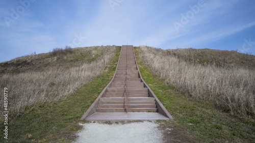 People walking up the prehistoric Monks Mound of Cahokia