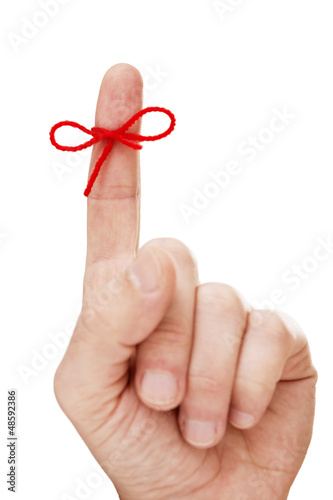 Finger with tied bow photo