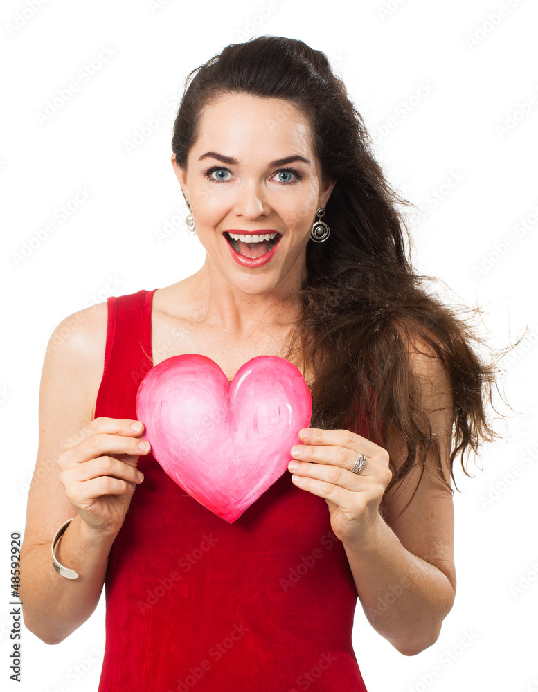 Beautiful happy woman holding a love heart Beautiful happy woman holding a love heart