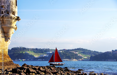 Red sailboat on Tejo river, Portugal