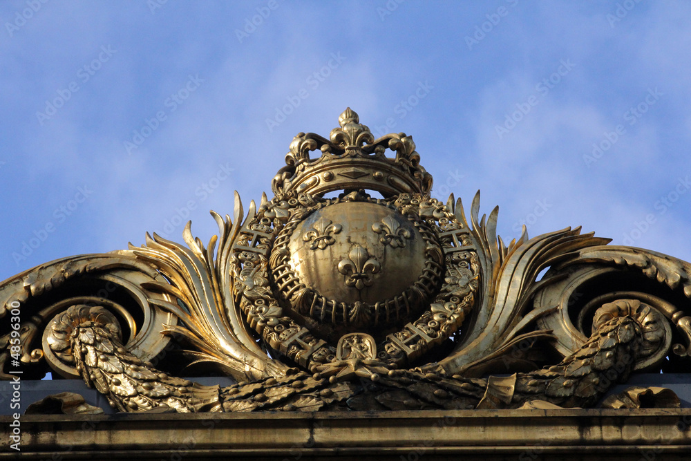 Detail of the golden gate at the justice palace in Paris