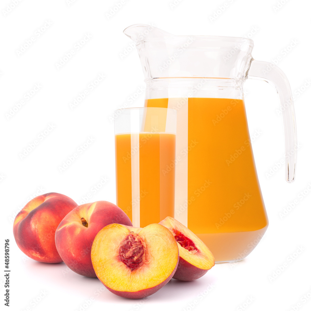Peach fruit juice in glass jug Peach fruit juice in glass jug