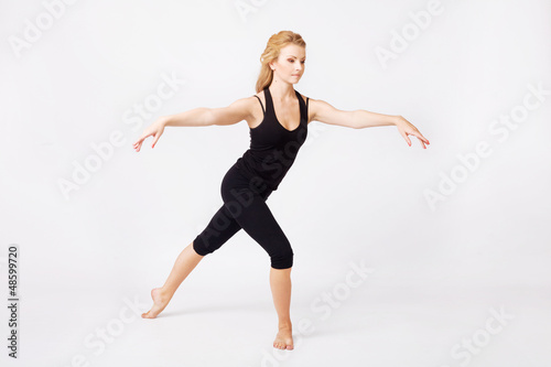 Sporty woman doing stretching exercise