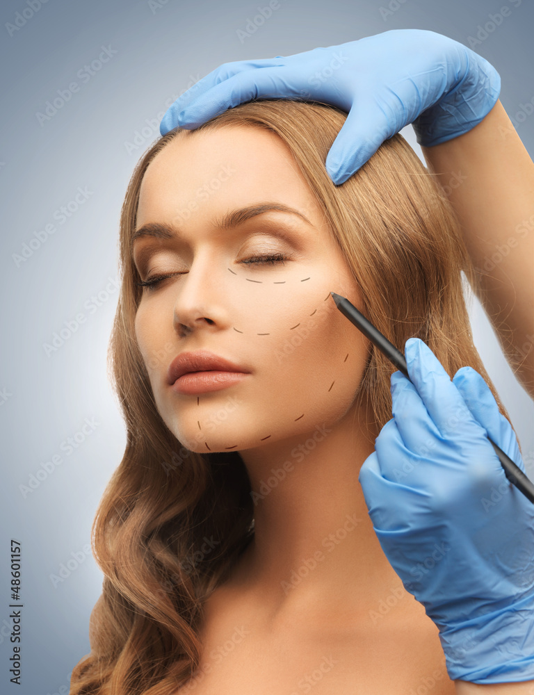 Naklejka premium woman face and beautician hands