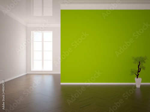 empty interior with a green wall and a tree
