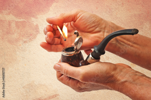 Obraz na plátne Tobacco smoking pipe in hand