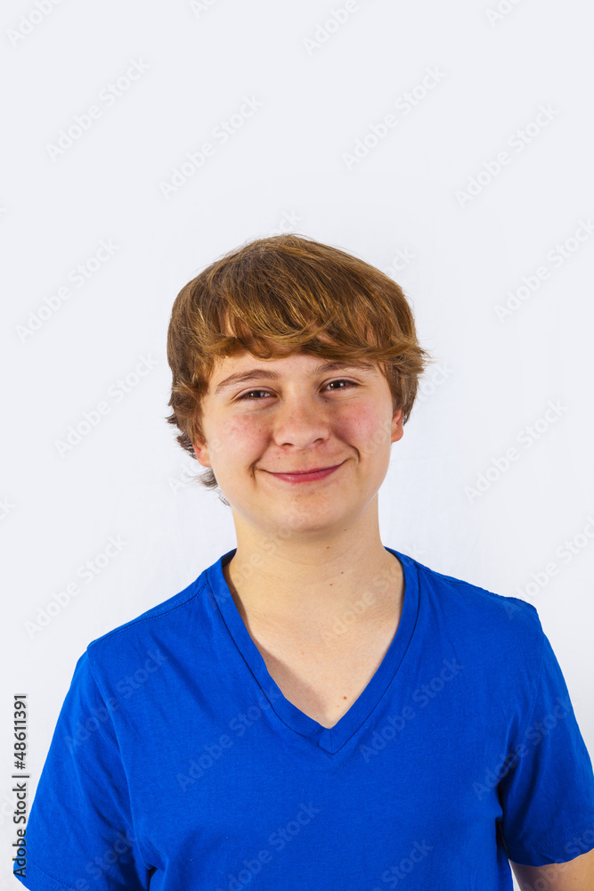 A smiling boy is showing his thumb up; isolated on the white bac A smiling boy is showing his thumb up; isolated on the white bac