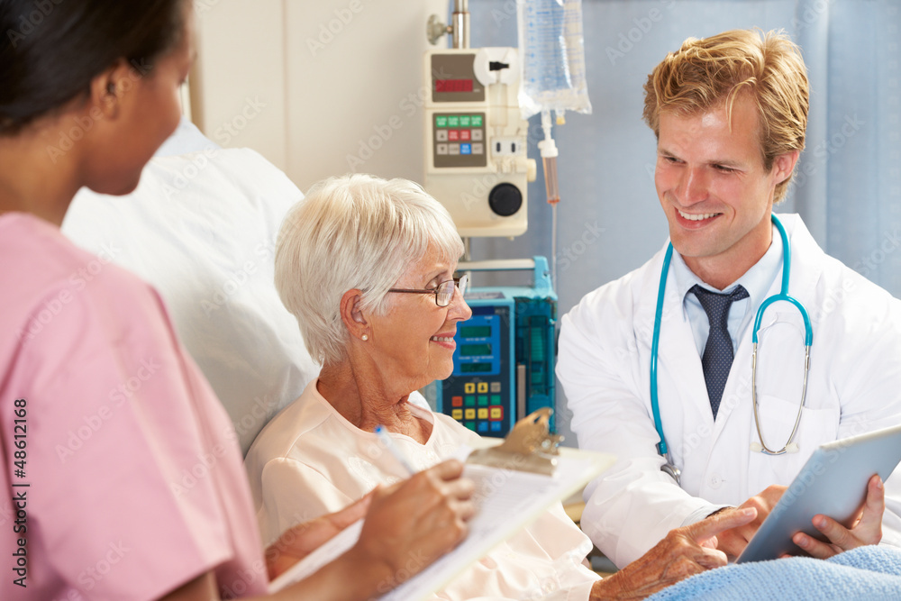 Doctor Using Digital Tablet In Consultation With Senior Patient Doctor Using Digital Tablet In Consultation With Senior Patient