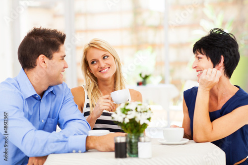 Slika na platnu happy young man meeting mother in law with his wife