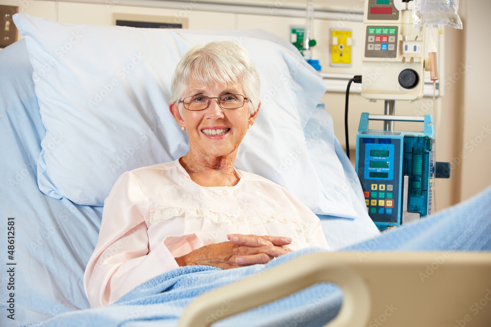 Obraz premium Portrait Of Senior Female Patient Relaxing In Hospital Bed