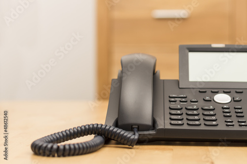 phone on desk with blurred background photo