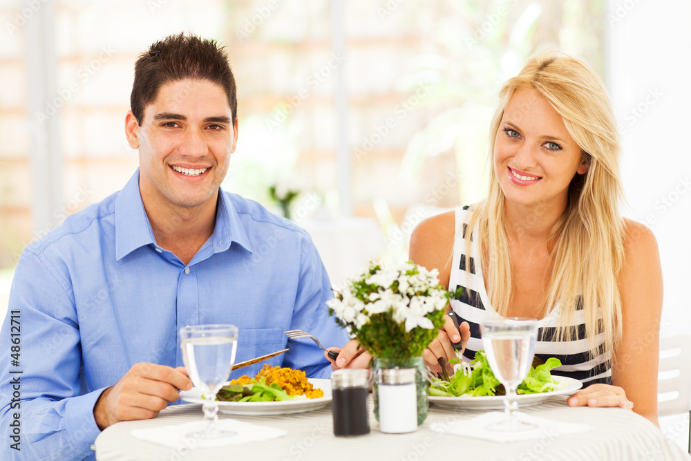 young couple having lunch in restaurant