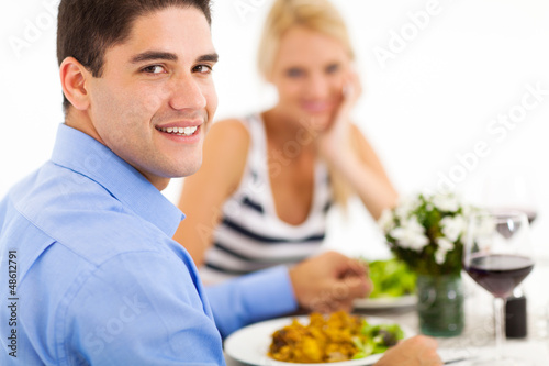 happy young couple dining out in restaurant