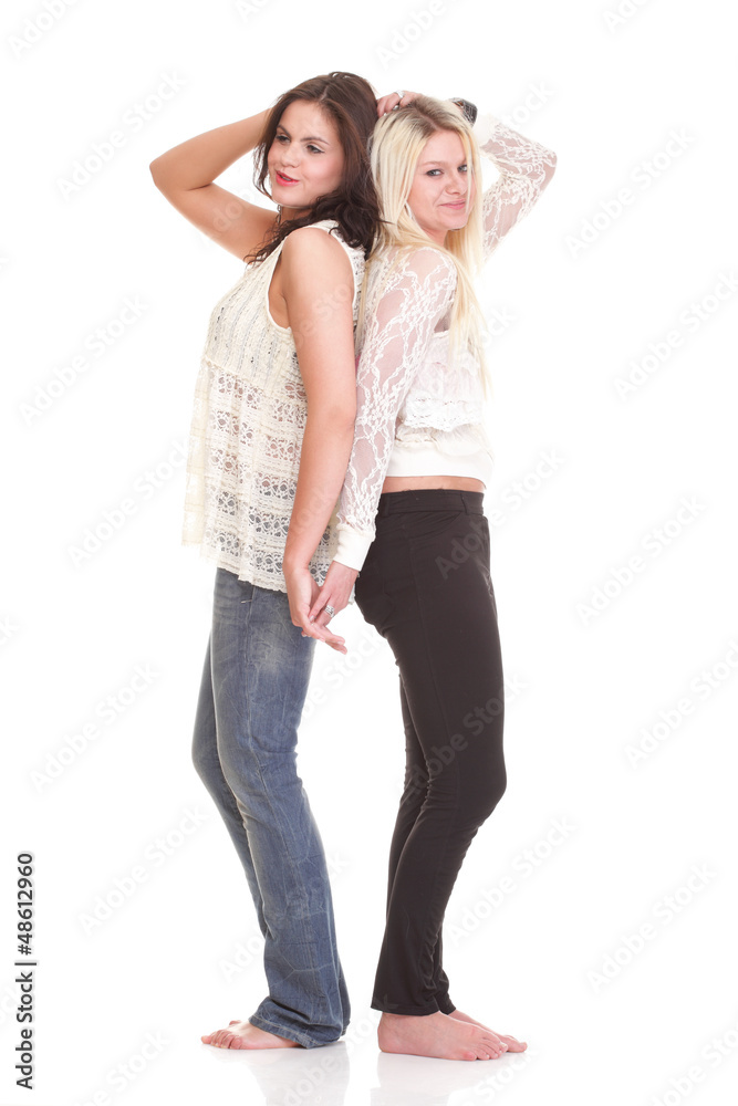 Full length Two attractive girl friends - blond and brunette is Full length Two attractive girl friends - blond and brunette is
