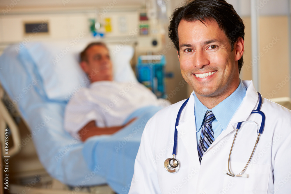 Portrait Of Doctor With Patient In Background Portrait Of Doctor With Patient In Background
