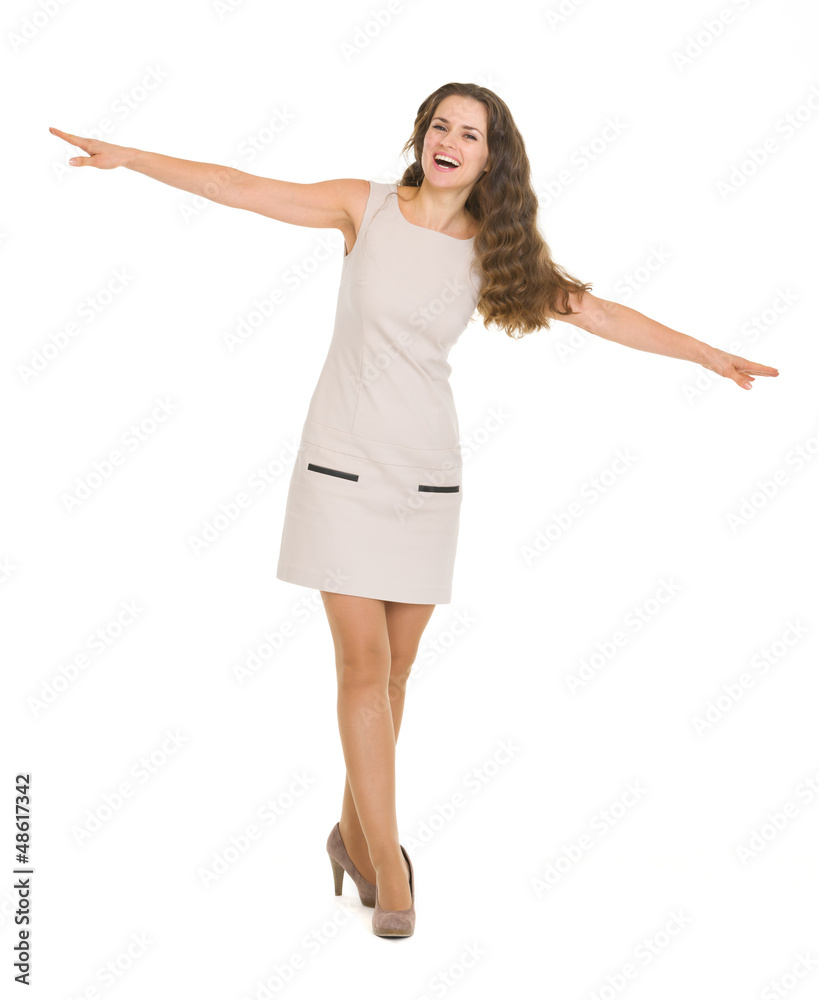 Full length portrait of happy young woman balancing Full length portrait of happy young woman balancing