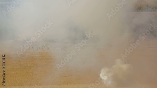 Troops on the battlefield during reenactment of a battle of 1812
