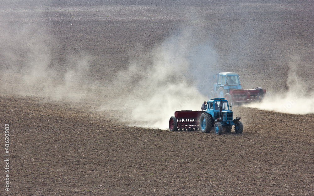 Naklejka premium Tractor plowing the field