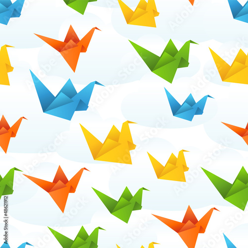 Origami paper birds flight abstract background.