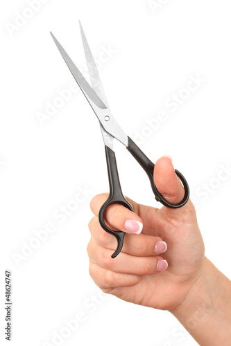 Female hand with scissors isolated on white