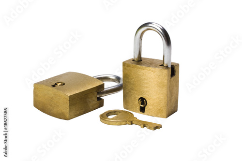 Close-up of two padlocks and a key