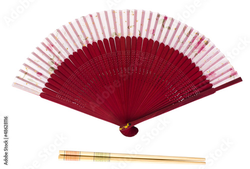Close-up of a folding fan with chopsticks