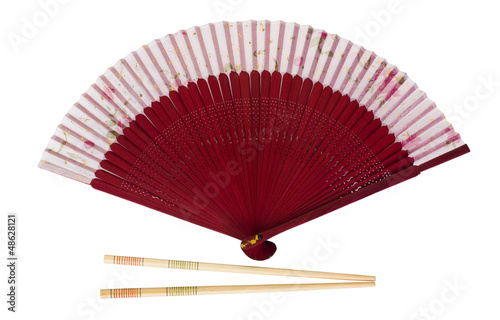 Close-up of a folding fan with chopsticks