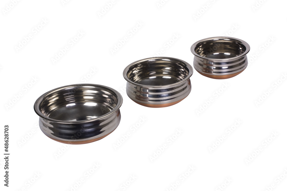 Close-up of three stainless steel cooking pots