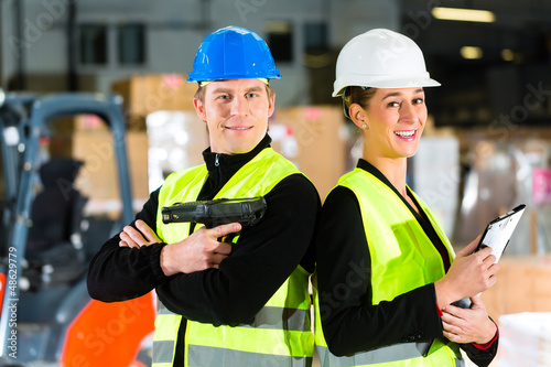 Forklift driver and supervisor at warehouse