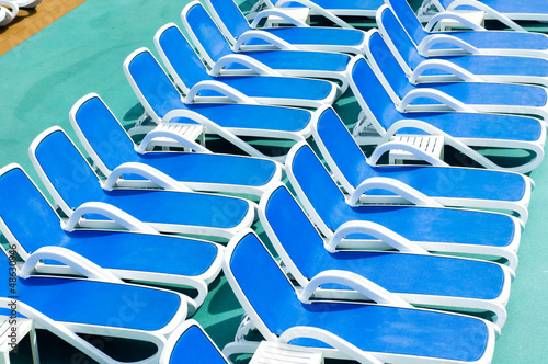 Close up view of blue deck chairs
