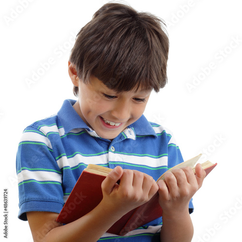Smiling boy reads book