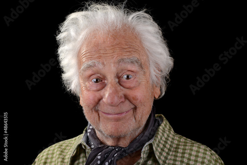 Funny old man with white hair smiling