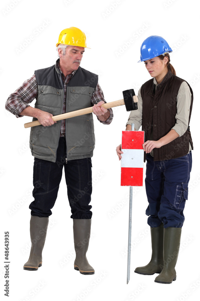 Senior craftsman and young craftswoman Senior craftsman and young craftswoman