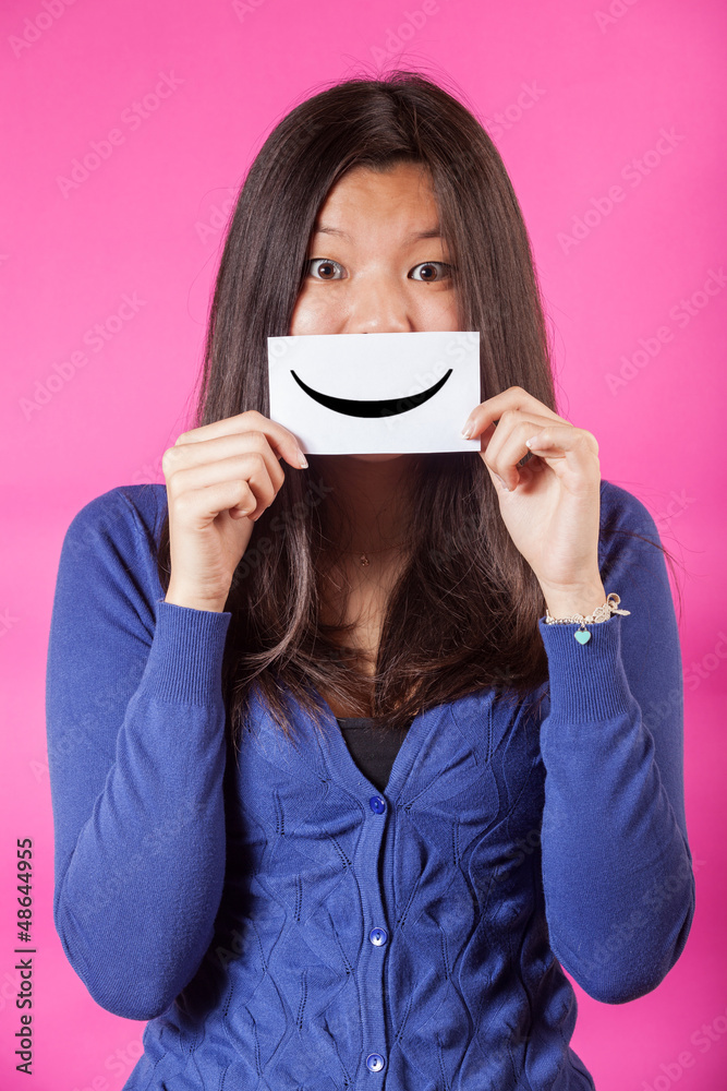 Chinese Woman Holding Smiling Emoticon Chinese Woman Holding Smiling Emoticon