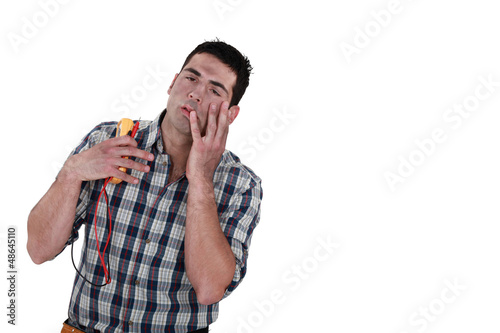 Fotografie electrician injured by electric shock