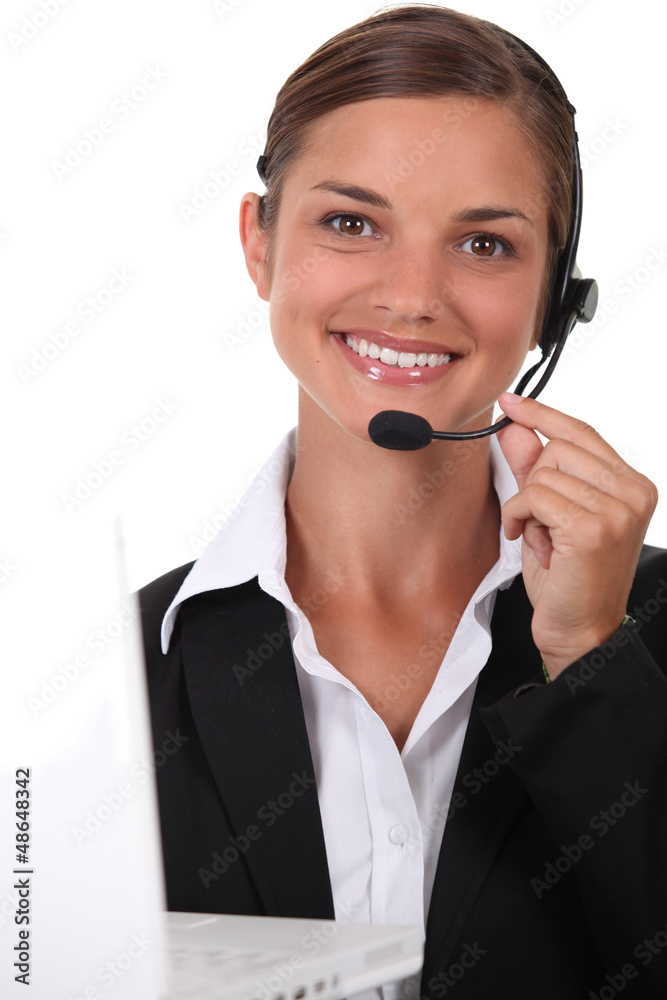 Receptionist with headset and computer Receptionist with headset and computer
