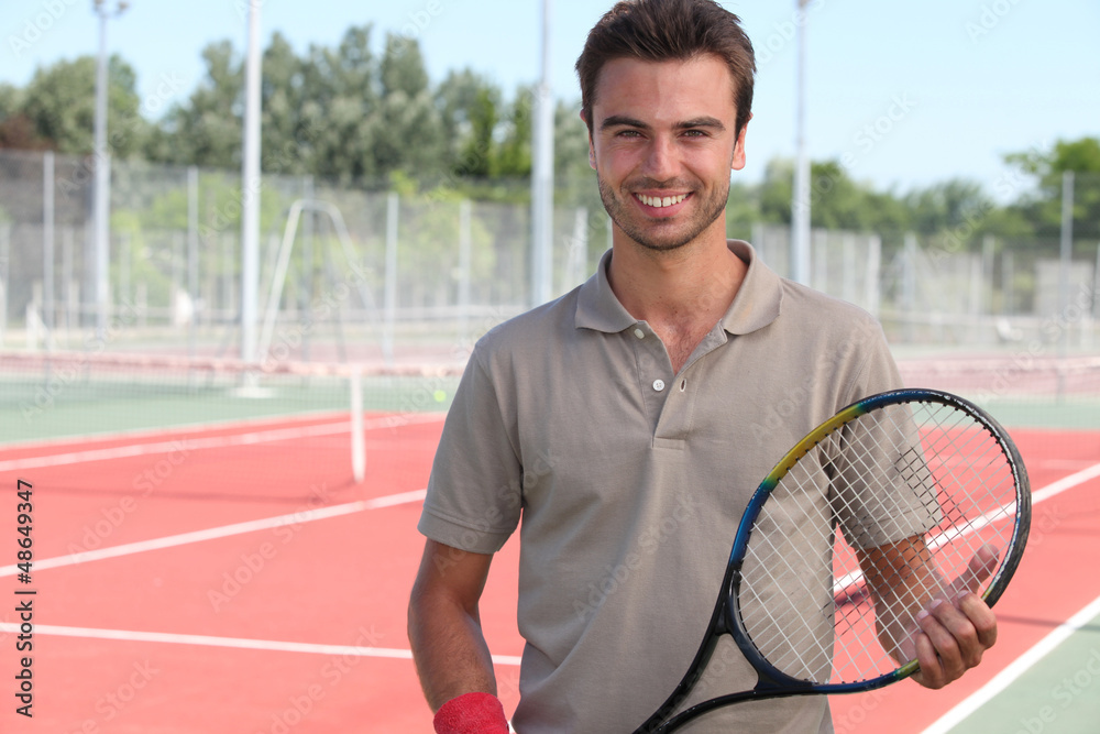 Male tennis player on a hardcourt