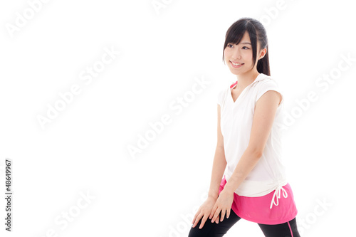 attractive sporty woman stretching on white backround